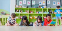 Children reading books on the floor