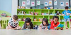 Children reading books on the floor