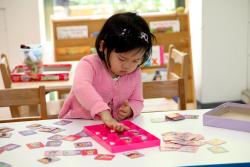 Toddler playing at a table