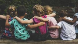 Group of children hugging each other