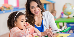 a teacher recording a childs behavior