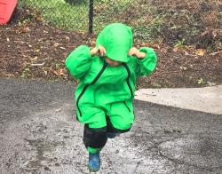 a child playing in the rain