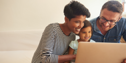 parents on the computer with their child