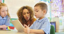 Teaching helping a student with a task in the classroom