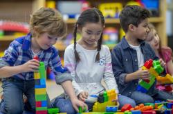 Children playing with blocks in the classroom