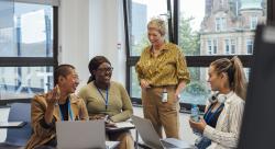 Teachers meeting with each other in a classroom