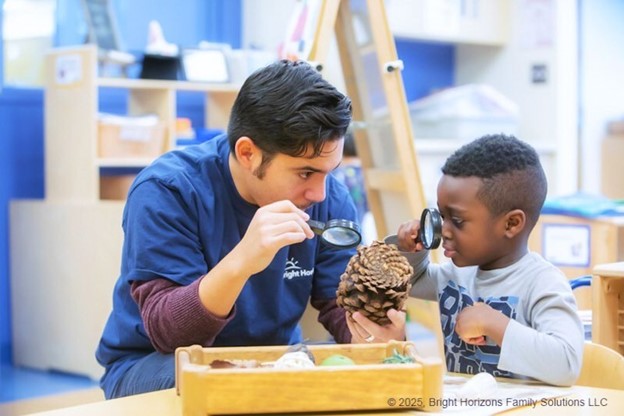 A teacher teaching a student about pinecones 