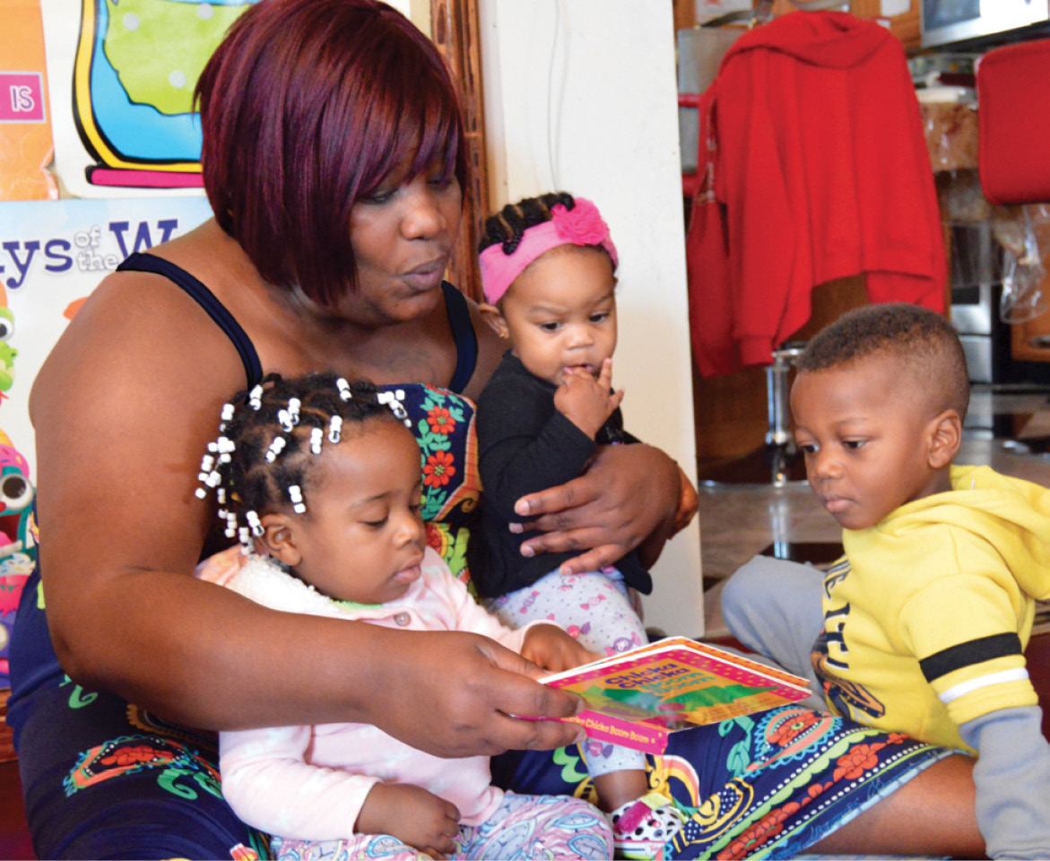 Shirnet Fray Palmer, teacher reading with her students