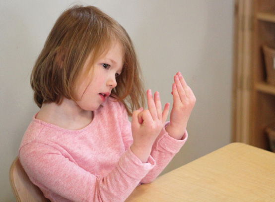 Girl counting her fingers